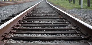 A PACKED TRAIN, DOZENS HURT — Sabotage SUSPECTED Railway tracks stretching into the distance