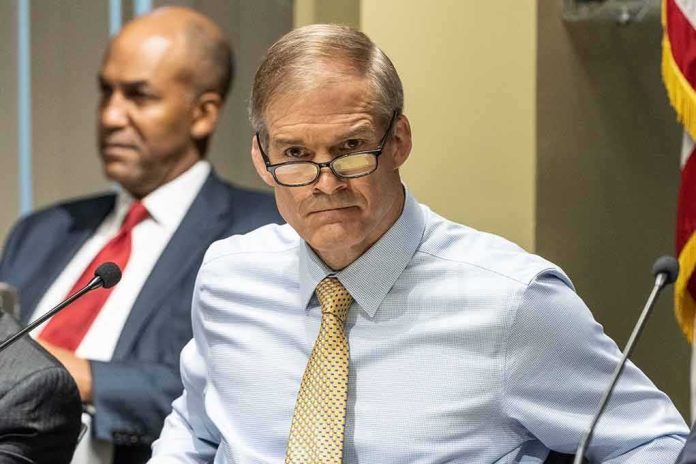 shutterstock_2290525951 Man in glasses at a meeting table