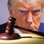 Donald Trump behind a judge’s gavel on a wooden desk