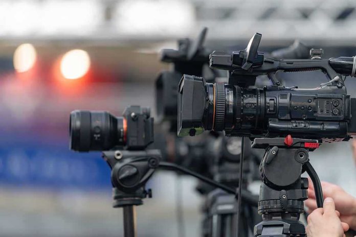 shutterstock_2762343045 Professional video cameras on tripods