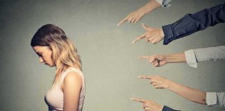 Nine Ex-Aides Turned On Dem Senate Hopeful — Then Came Her EXCUSE Young woman looking down while multiple hands point at her
