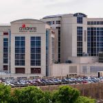 Two Hospitals Cut A Deal With DOJ — Look What They Agreed To STOP children's medical center hospital exterior with parking lot