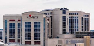 Two Hospitals Cut A Deal With DOJ — Look What They Agreed To STOP children's medical center hospital exterior with parking lot