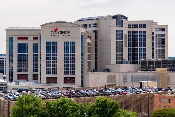 shutterstock_309089327 children's medical center hospital exterior with parking lot