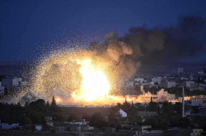 Large explosion over a city at night