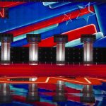 Viral CNN Meltdown Over Spencer Pratt’s LA Mayor Bid! Debate stage with four podiums and colorful star backdrop