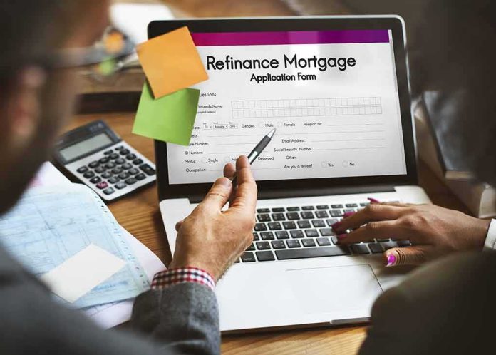 Laptop displaying refinance mortgage application form