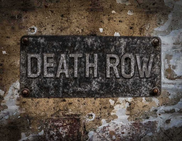 shutterstock_533872477 Rusty metal DEATH ROW sign on a worn concrete wall