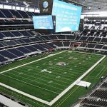Stadium UNEXPECTED Cleaners HUMBLE America’s Elites American football stadium interior with large central video board