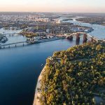 Aerial view of a river city with bridges and green islands