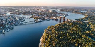 Aerial view of a river city with bridges and green islands
