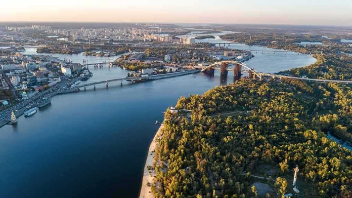 Aerial view of a river city with bridges and green islands