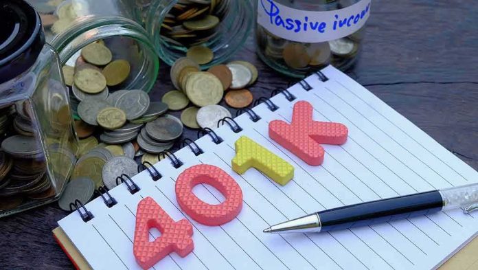 shutterstock_1023681001-1 401k letters on notebook with coins and jars