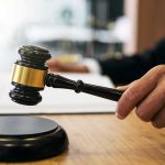 Gang Boss CASHED IN On A Murder. What He WROTE Sank Him Judge's hand holding a gavel over a sound block