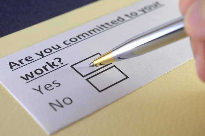 shutterstock_1117907957 Pen hovering over yes no checkbox on questionnaire