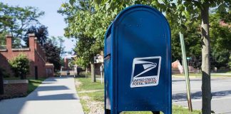 ALERT: Latest Mail Scare Just Got BIGGER — See Who ELSE Was Targeted Blue USPS mailbox on a suburban sidewalk