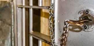 Shooter Was ALREADY Wanted — What Cops Caught Him With Prison cell door with key and chain in lock