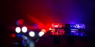 AG’s UNEXPECTED Ruling For 3 DEADLY Shots Police car light bar flashing red and blue at night