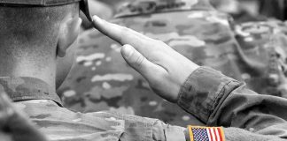 Trump Goes To BAT For OUR Troops — Look Who OBJECTS Soldier saluting with an American flag patch on sleeve
