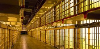 Jailed Democrat Runs For Congress — His BRAZEN PLAN REVEALED Prison cell block corridor with barred cells and upper walkways