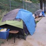 Tent encampment along a city sidewalk