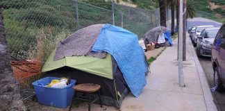 Tent encampment along a city sidewalk
