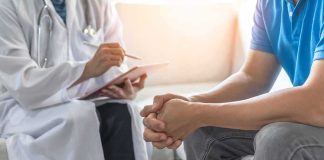 URGENT RECALL: Men’s Pill — No one taking it ever KNEW… Doctor consulting a patient on a sofa