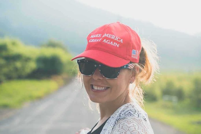 shutterstock_1508232545 woman in red cap and sunglasses smiling outdoors