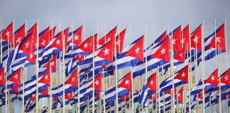 EXPOSED: Mamdani’s Cuba Adviser Is STILL Helping Communists Cuban flags on numerous flagpoles