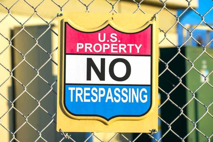 No trespassing sign on chain-link fence