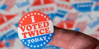 Election Cheats, BEWARE — Look What Trump Just Offered Hand holding a red, white, and blue voting sticker