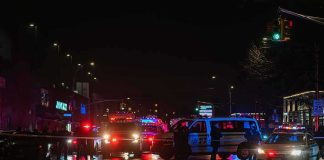 This Guy’s Campaign Was Wrecked Before Sunrise Nighttime police scene with flashing lights on a wet city street