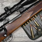 Bolt-action rifle with scope and rifle cartridges