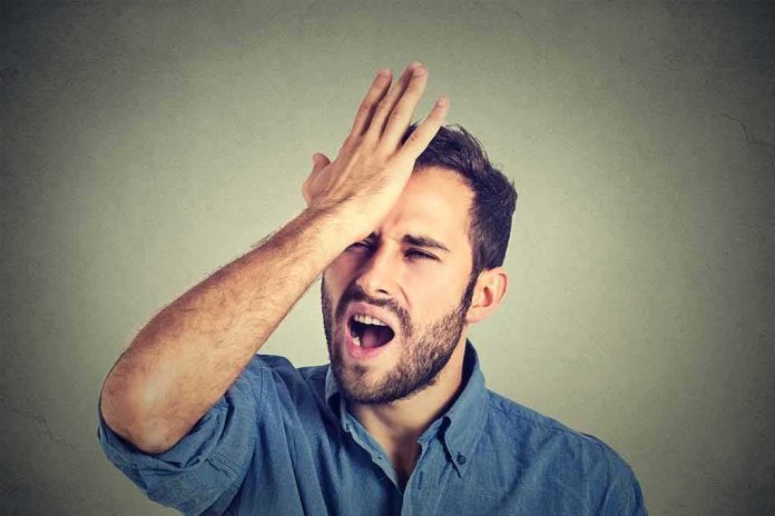 shutterstock_325349966 Man with hand on forehead expressing frustration