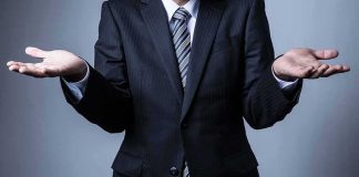 Democrat AG Went SOFT On 30 Killers — Now He Wants To Be Governor! Businessperson in suit shrugging with open hands