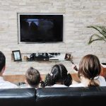 Supreme Court May Make Hollywood PAY For SNOOPING A family of four watching television together in a cozy living room