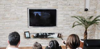 Supreme Court May Make Hollywood PAY For SNOOPING A family of four watching television together in a cozy living room